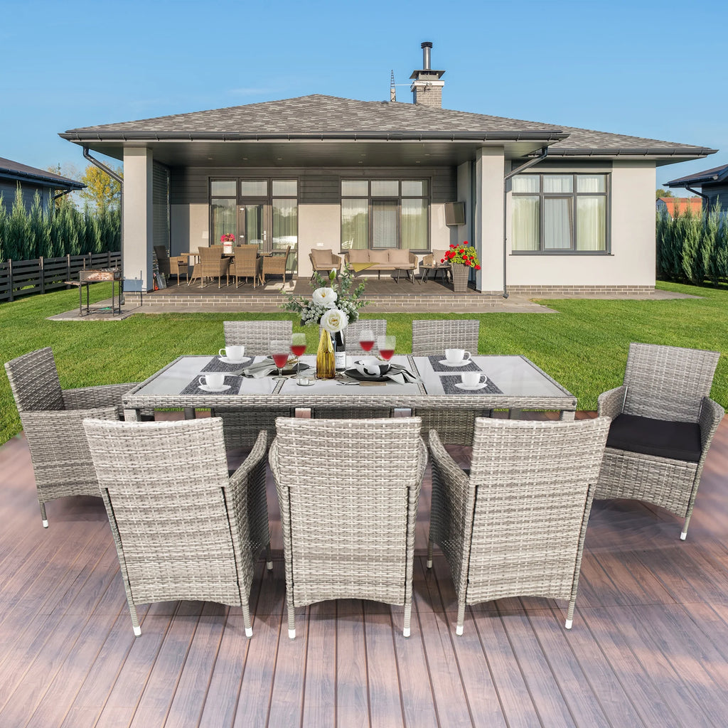 9 Pieces Wicker Outdoor Dining Set with Glass Tabletop and Cushioned Chairs Z540818